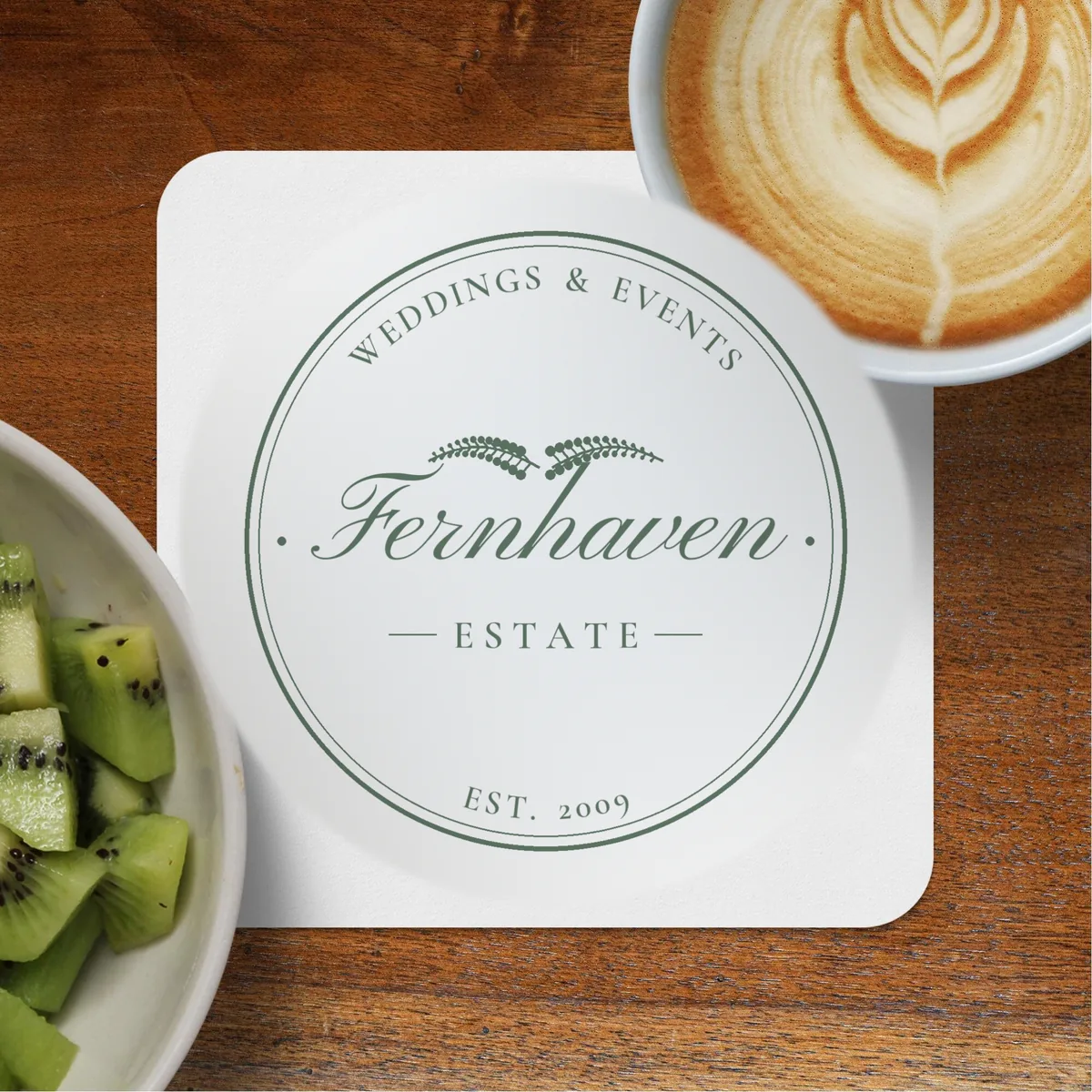 Square coaster printed with a sample venue logo