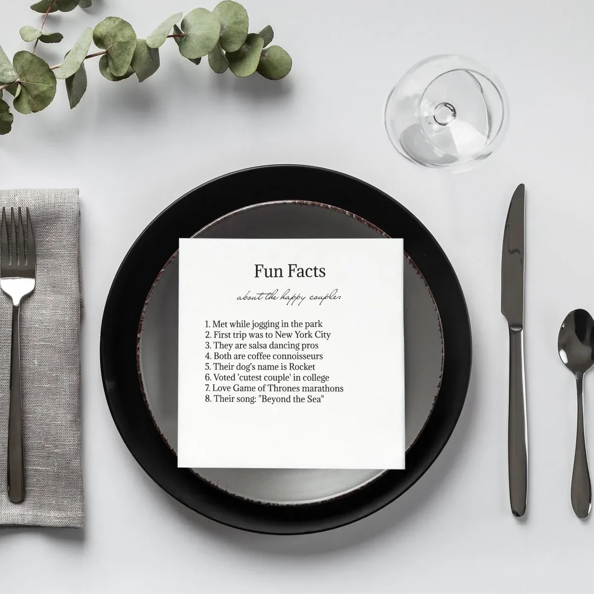 Fun-fact trivia napkin on a dinner plate